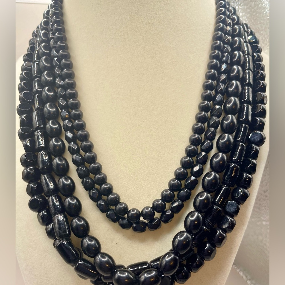 Black 5 strand multi shape beaded necklace. Silver tone. 16 inch. 3 1/2 extender